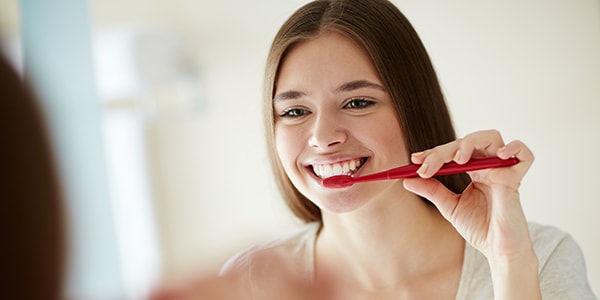 Change your brushing habits to help stop teeth sensitivity