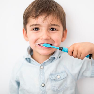 Boy brushing his teeth.